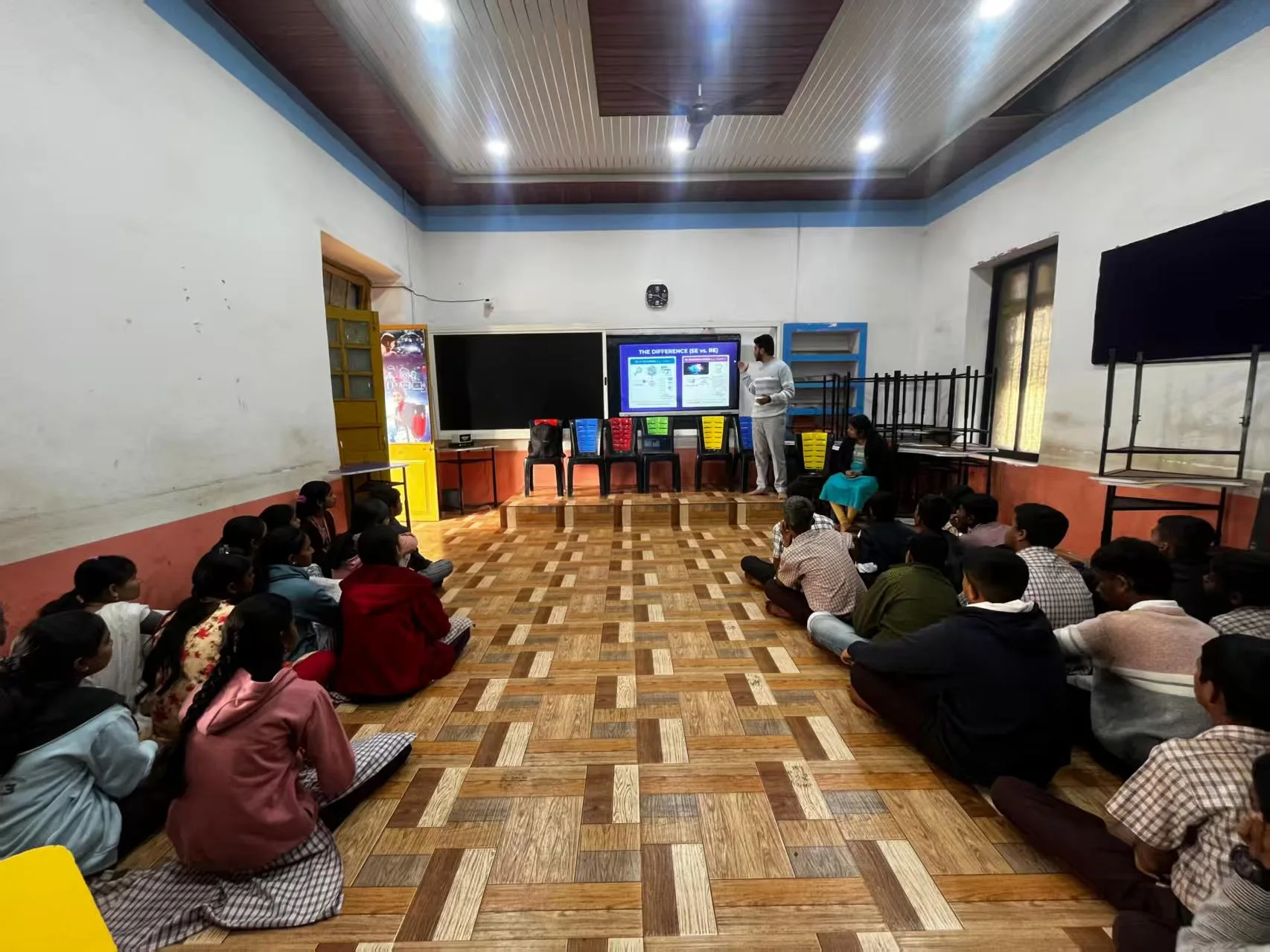 An educator connecting a classroom in India with a remote learning session